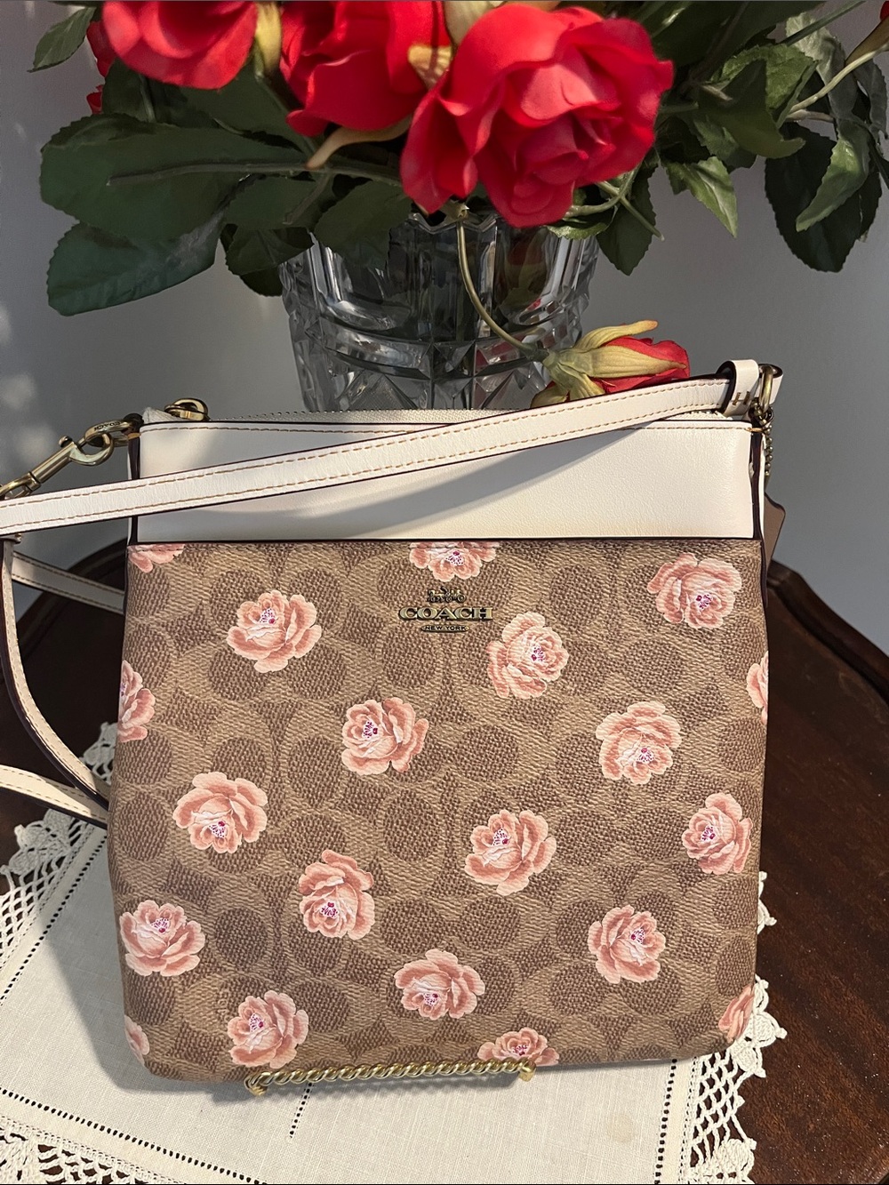 Like new!  Coach Kitt floral print messenger crossbody bag.